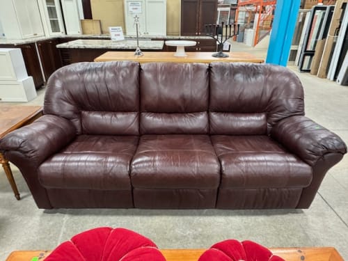 Brown leather couch with recliner